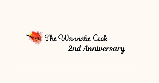 The Wannabe Cook second-anniversary artwork on a warm cream background.